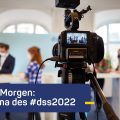 Foto mit einer Fernseh-Kamera und dem Text: "überMorgen" - Thema des #dss2022